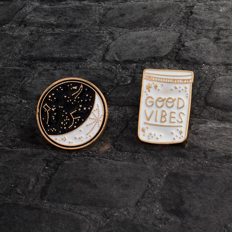 Good Vibes and Moon enamel pins
