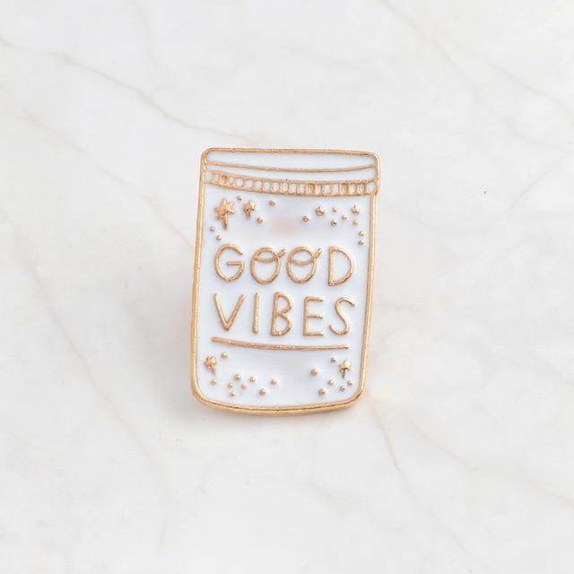 Good Vibes and Moon enamel pins