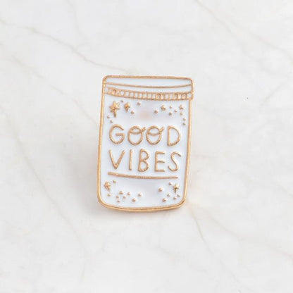 Good Vibes and Moon enamel pins